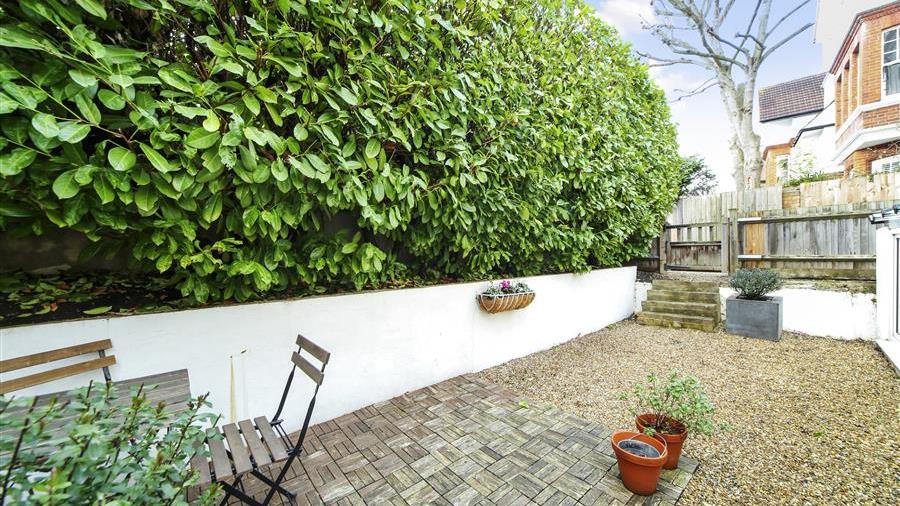 Flat for sale in Lytton Grove, SW15 featuring a garden and a garage